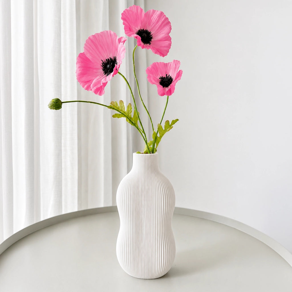 Wavey Vase – Elevate your space with this modern decorative vase featuring elegant wavy contours and artistic design. Perfect for fresh flowers, dried arrangements, or as a stylish standalone home décor accent.